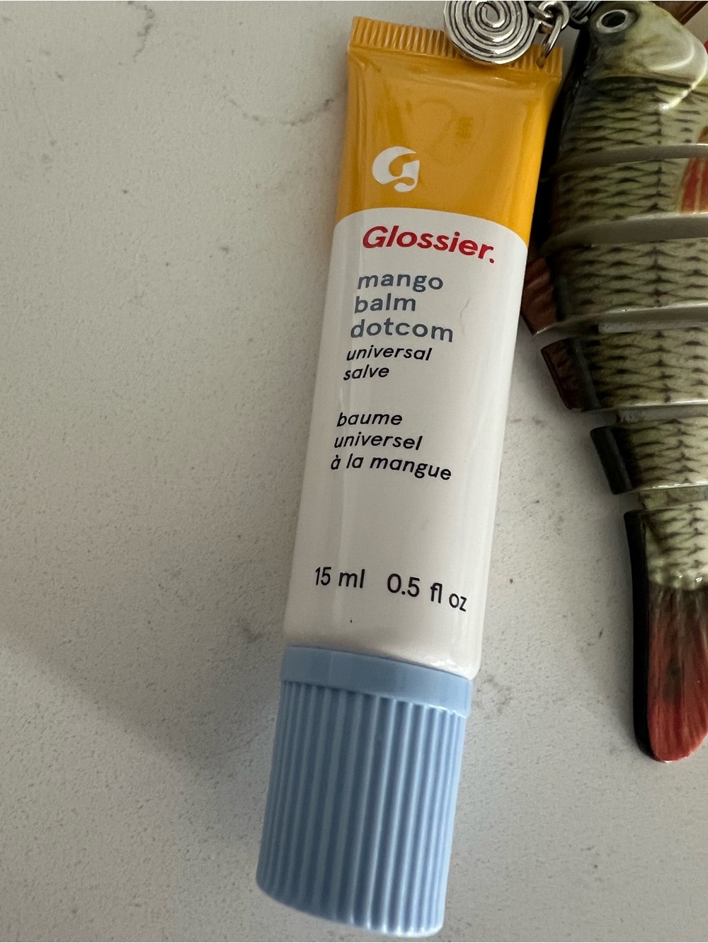 Glossier Mango Balm Dotcom — White, Yellow & Light Blue Tube bag charm